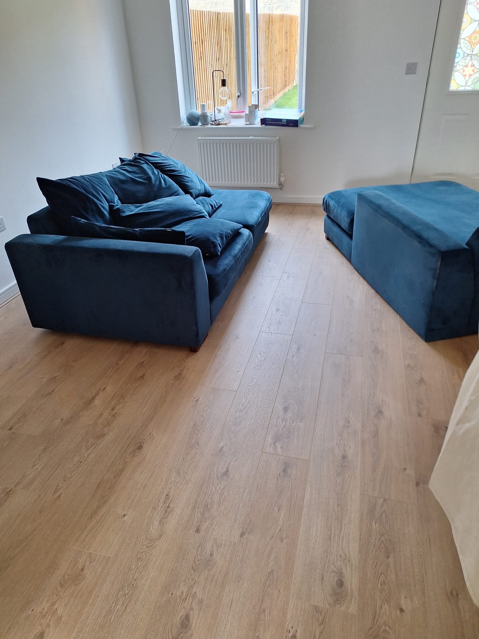 Light oak laminate flooring fitted in a Bristol living room