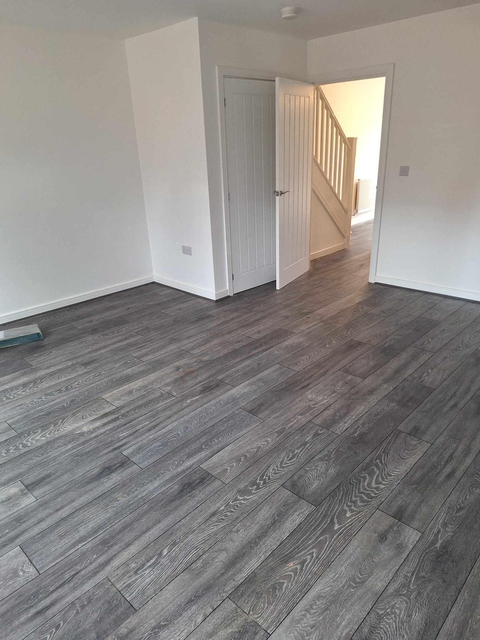 Oak-effect laminate flooring installed in a Bristol kitchen