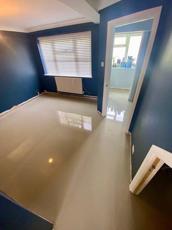 Empty room with concrete subfloor ready for new flooring in Bristol