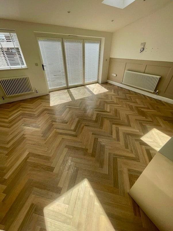 Herringbone wood-effect flooring in open-plan Bristol living area